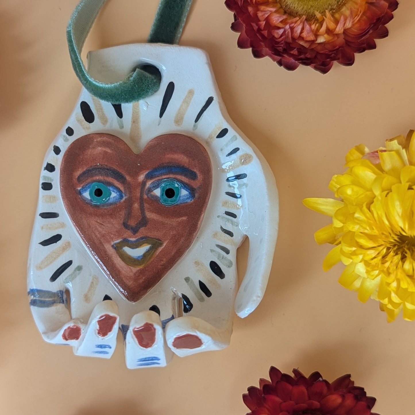 'Heart in Hand' Hanging Decoration by Ciara Veronica Dunne